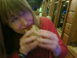 Ez man-handles the Spicy Polish at Chris and Rob's